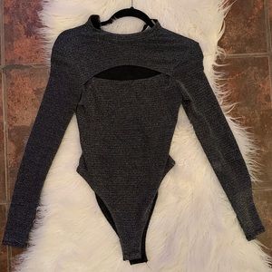 Grey sparkly long sleeve body suit.
